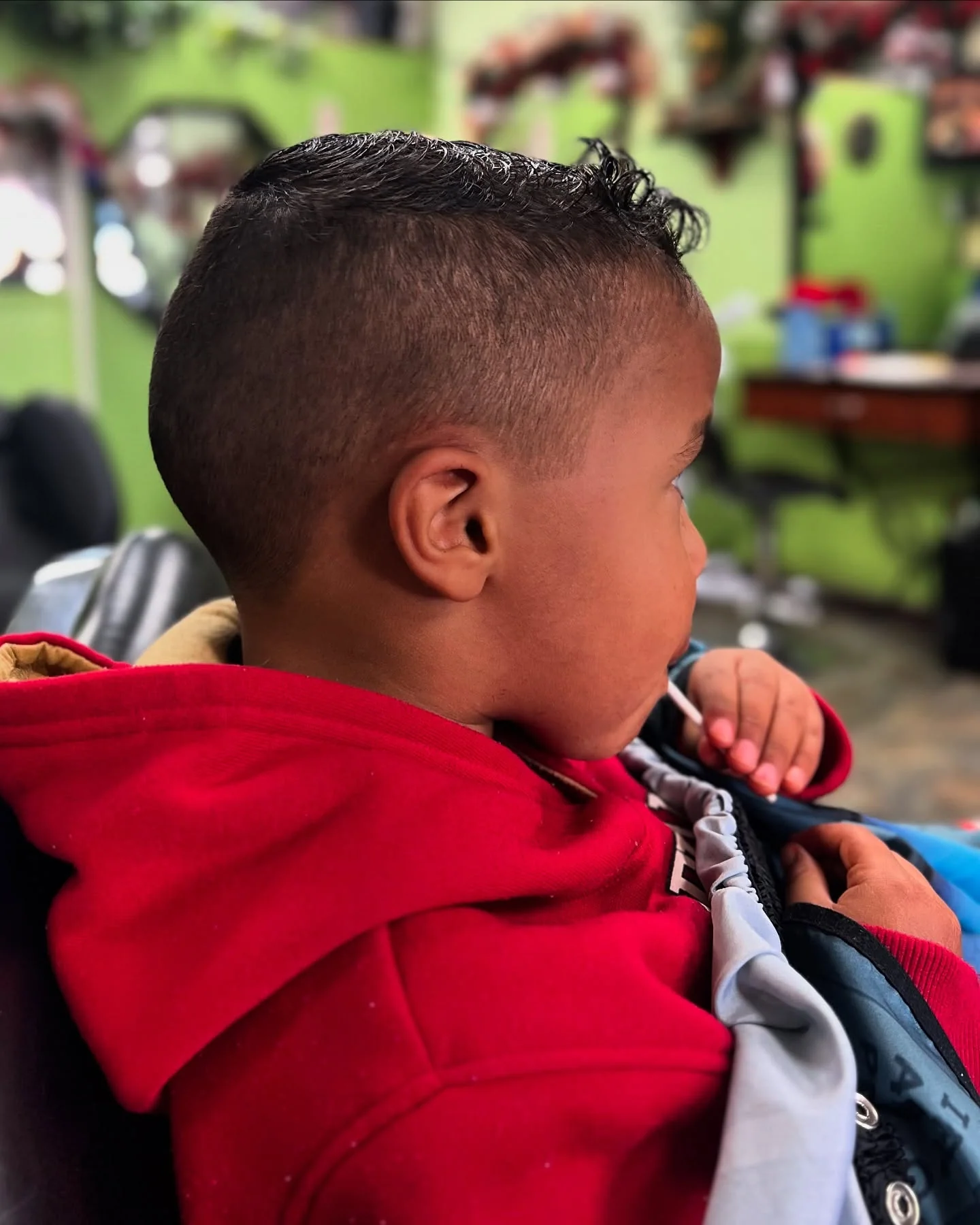 Photo of a children’s haircut at Tijeras Barbershop