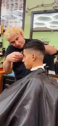 Edwin detailing a fade and hairline at Tijeras Barbershop