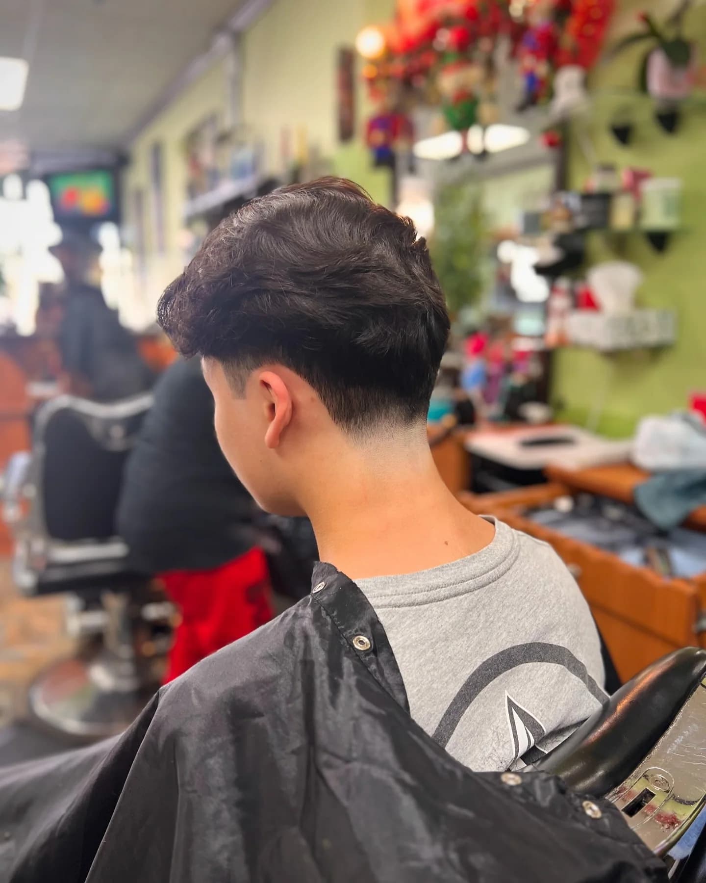 Finished fade viewed from the left side inside Tijeras Barbershop